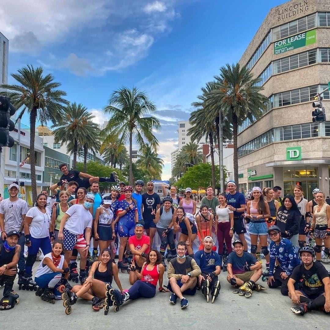 Skaters gathered on Lincoln Road under palm trees