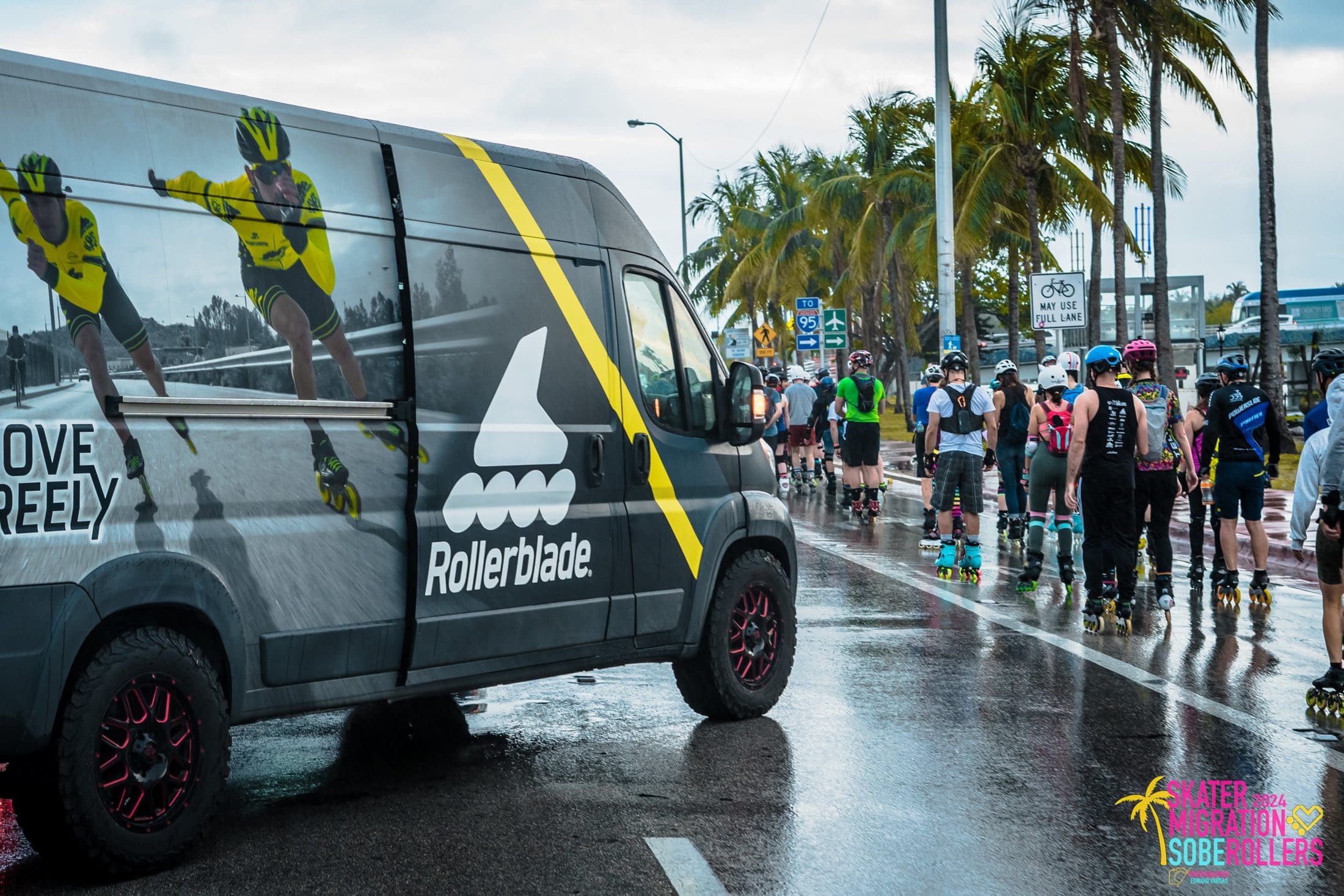 Skaters rolling past the Rollerblade van on a wet Miami Beach street