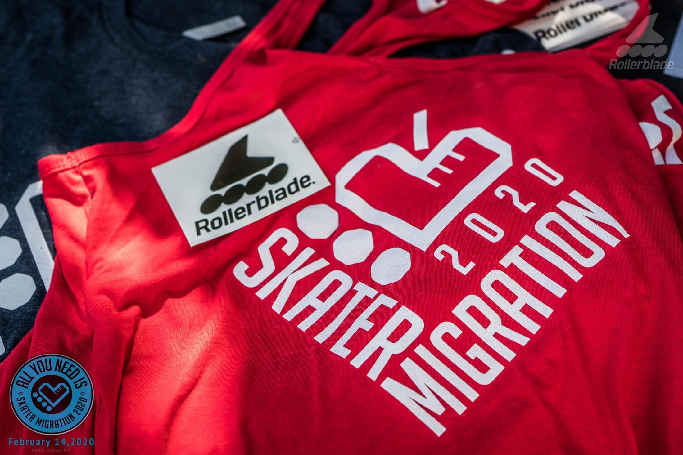 The red Skater Migration 2020 T-shirt with the heart-of-wheels logo and a Rollerblade patch