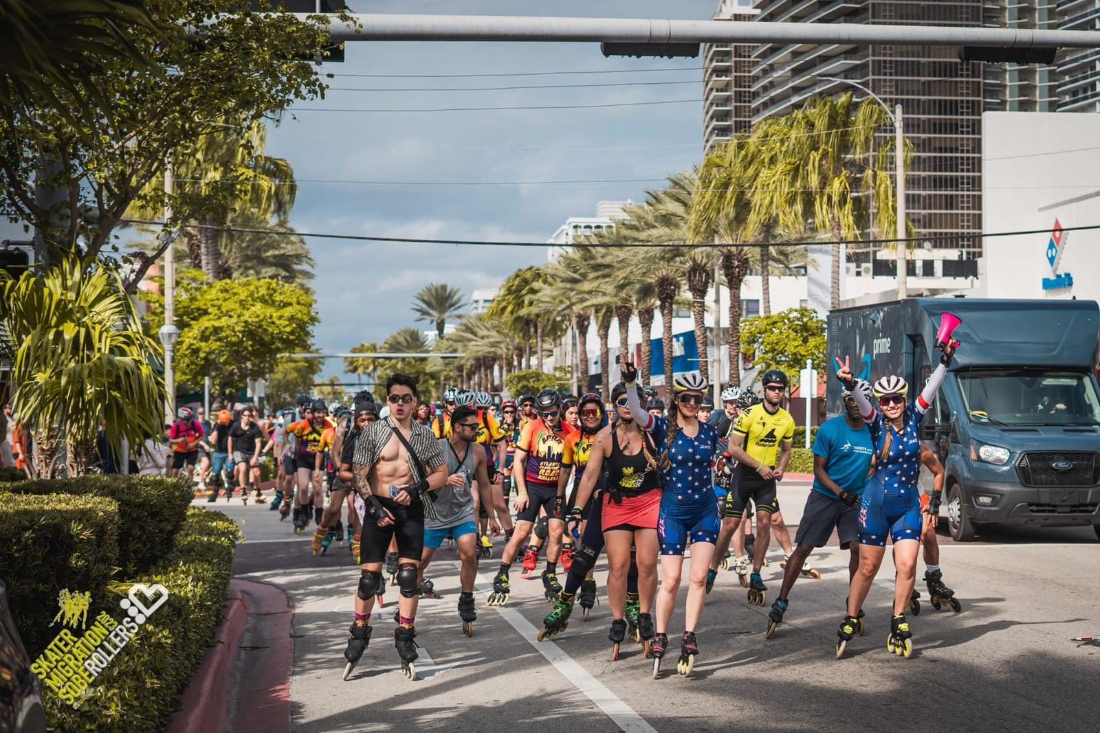 Skaters in team kits and pads rolling down a palm-lined avenue